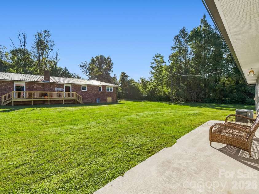 17 Randolph Avenue, Flat Rock, NC 28731.  MLS# CAR4428296, YatesRealty ID 55829. Back Patio on the Duplex on Randolph Road