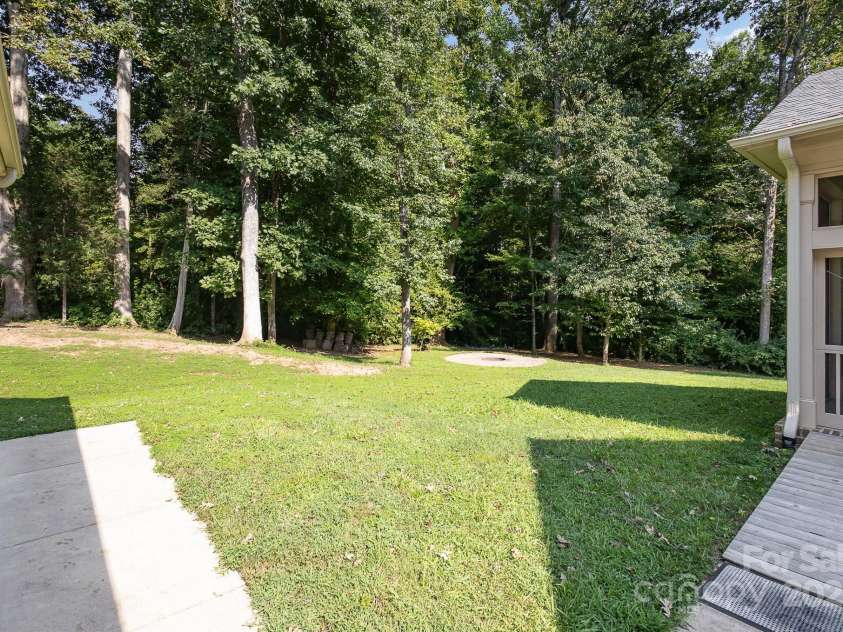 5888 Hidden Oaks Lane, Clover, SC 29710.  MLS# CAR4171785, YatesRealty ID 5584. View to the fire pit out back