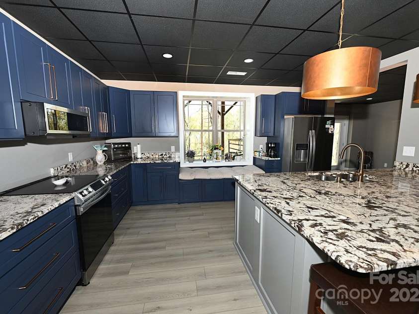 2757 Trent Drive, Conover, NC 28613.  MLS# CAR4318412, YatesRealty ID 5585. Basement Kitchen