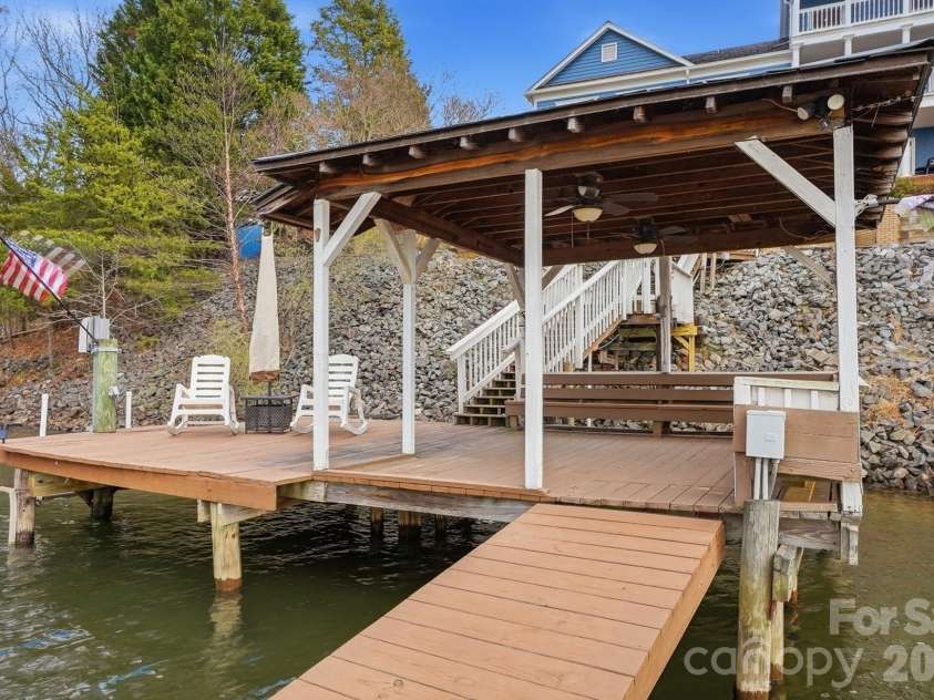 18212 Tayport Drive, Charlotte, NC 28278.  MLS# CAR4346978, YatesRealty ID 5586. Spend your days boating or fishing from your dock with lift, then unwind under the covered dock while taking in tranquil lake views