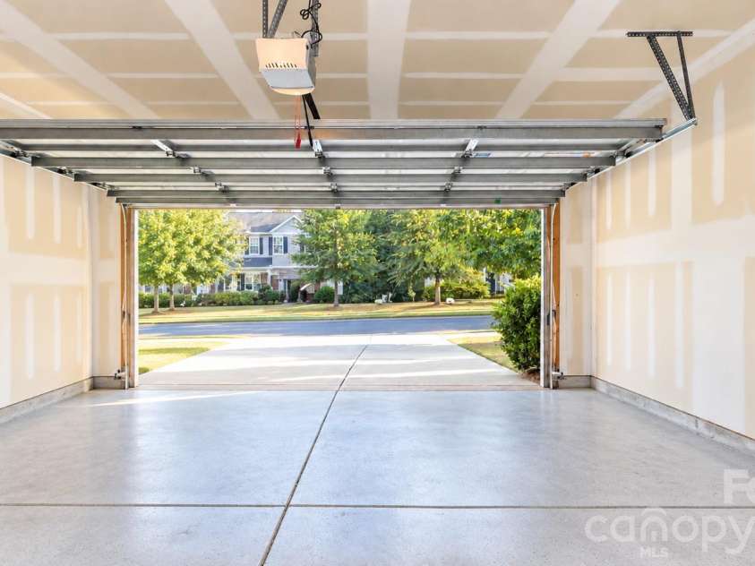 239 Keating Place Drive, Fort Mill, SC 29708.  MLS# CAR4429689, YatesRealty ID 55861. AI Cleaned up garage