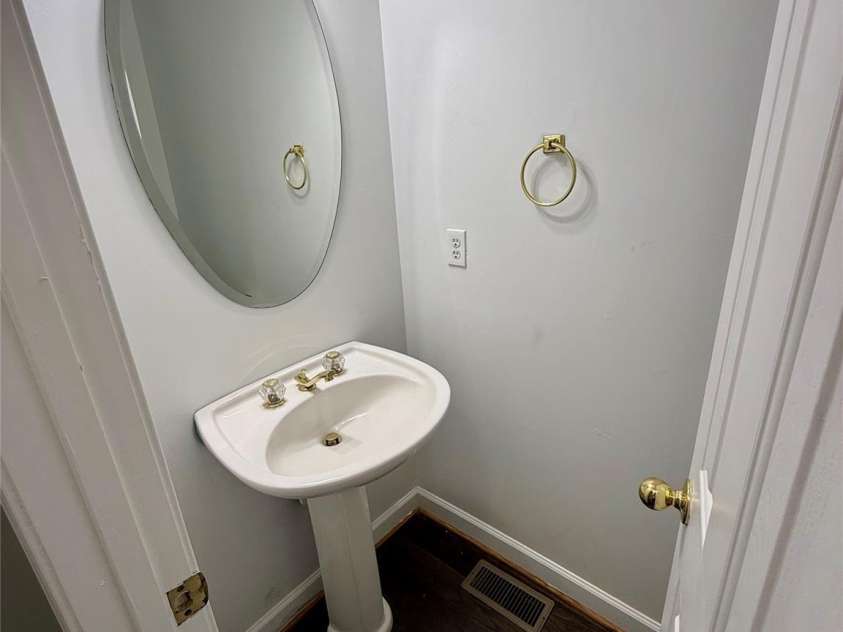 1503 Copperplate Road, Charlotte, NC 28262.  MLS# CAR4429268, YatesRealty ID 55875. Downstairs Guest Bathroom