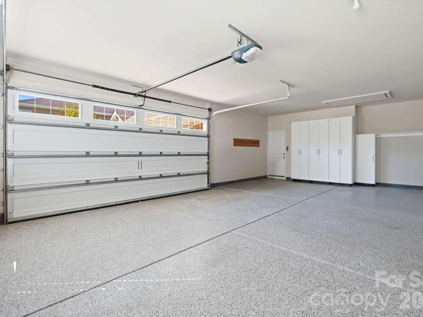 9106 Longvale Lane, Charlotte, NC 28214.  MLS# CAR4432949, YatesRealty ID 55876. New garage doors, epoxy flooring