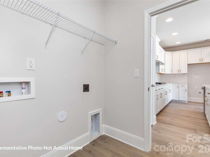 10233 Rainier Trail Drive, Huntersville, NC 28078.  MLS# CAR4399099, YatesRealty ID 55887. Laundry to Kitchen-Merlot