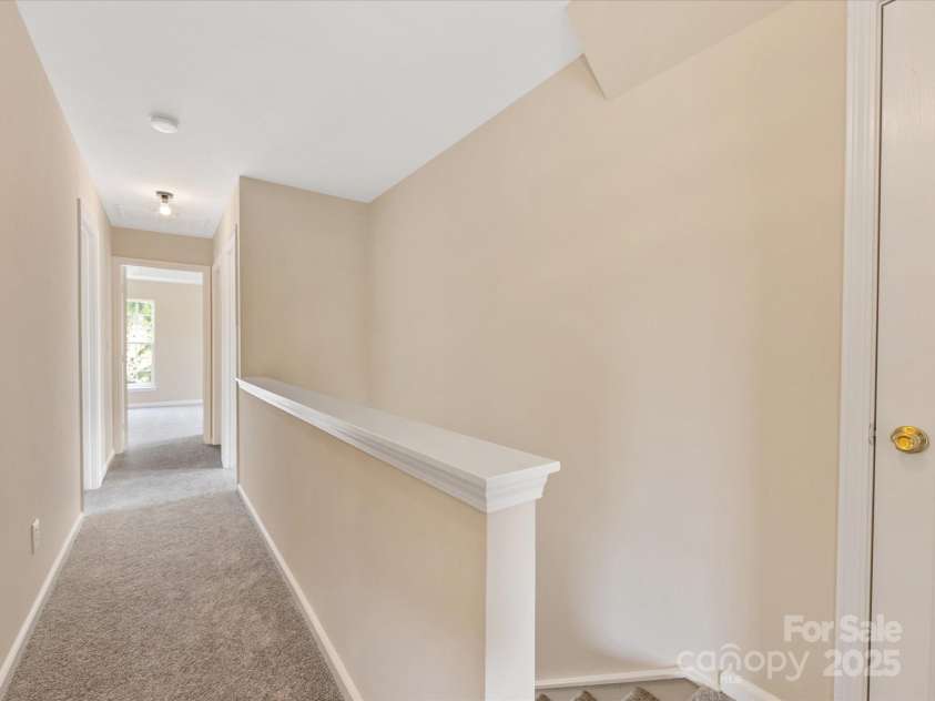 1102 Balcorn Place, Charlotte, NC 28214.  MLS# CAR4234587, YatesRealty ID 5590. Upper Level Hallway - Linen Closet at the top of the Stairs