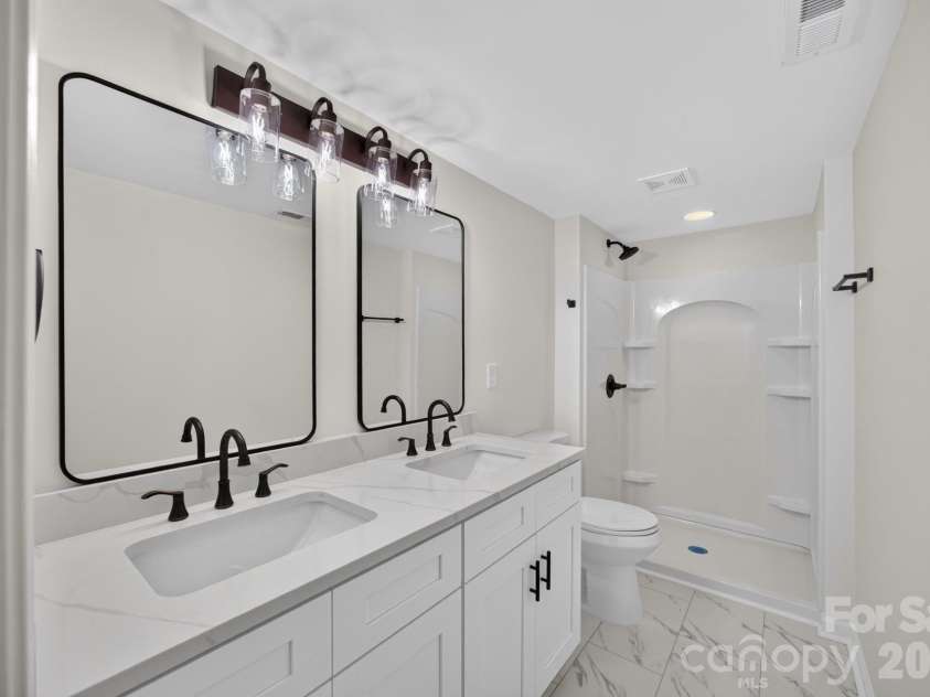 5550 Overlook Circle, Winston Salem, NC 27105.  MLS# CAR4432343, YatesRealty ID 55933. Bathroom (Basement)