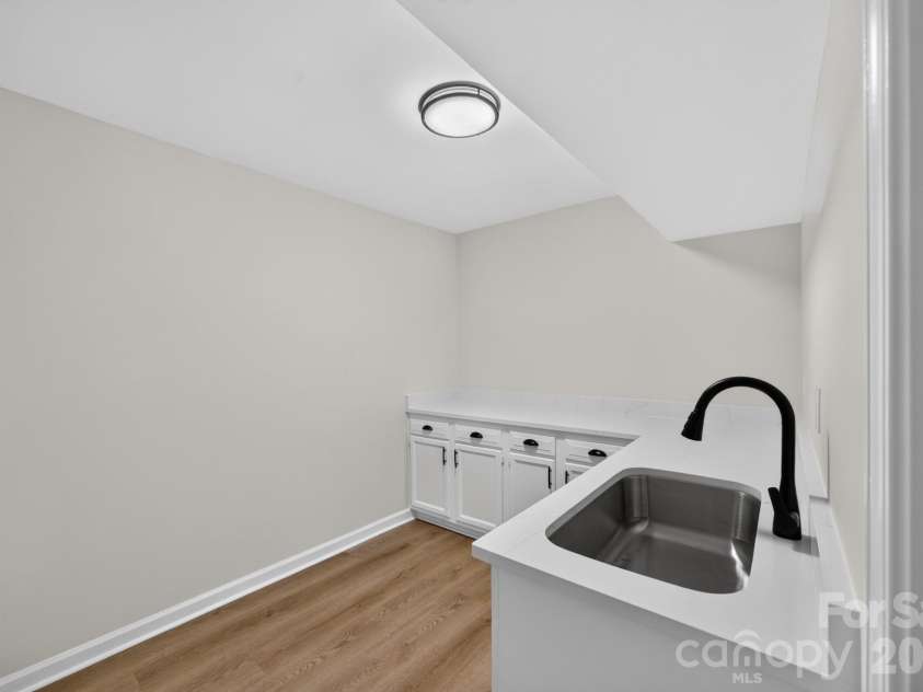 5550 Overlook Circle, Winston Salem, NC 27105.  MLS# CAR4432343, YatesRealty ID 55933. Laundry (basement)