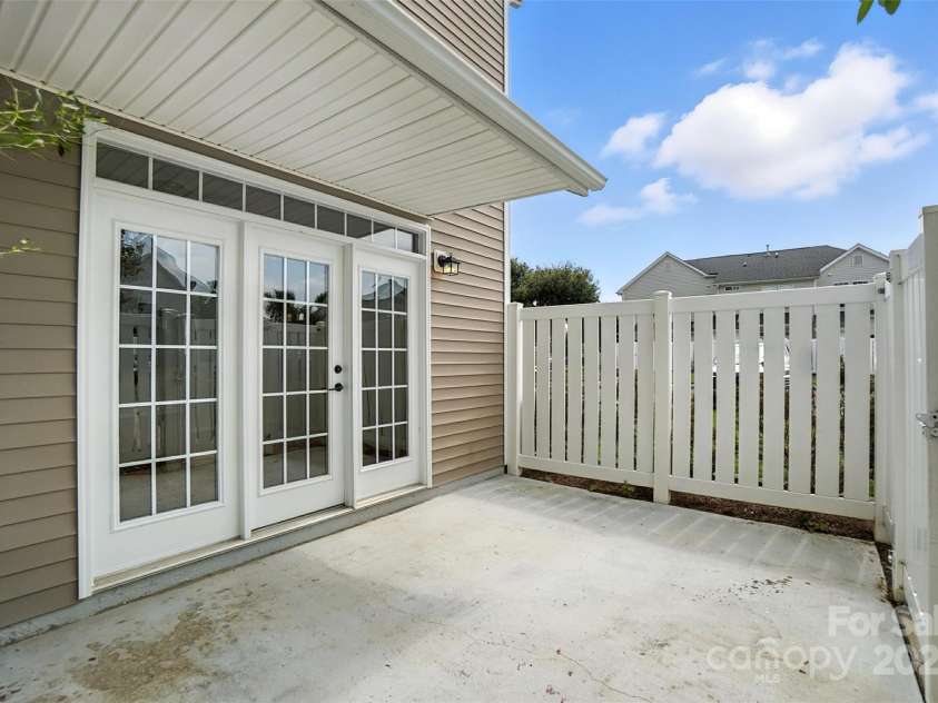 4133 Carl Parmer Drive, Harrisburg, NC 28075.  MLS# CAR4288462, YatesRealty ID 5595. Fenced in Patio