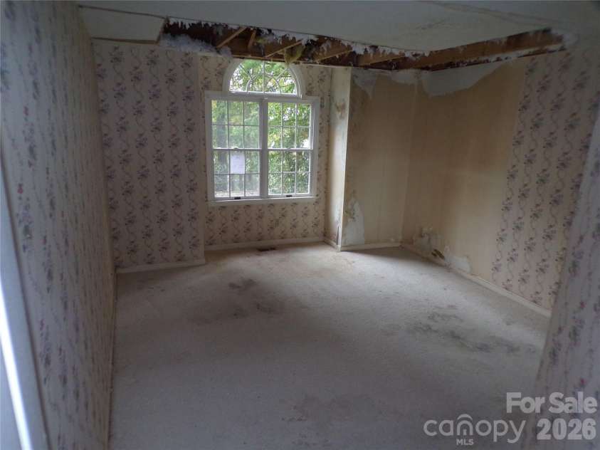 10 Governors Drive, Hendersonville, NC 28791.  MLS# CAR4433249, YatesRealty ID 55977. Front left bedroom