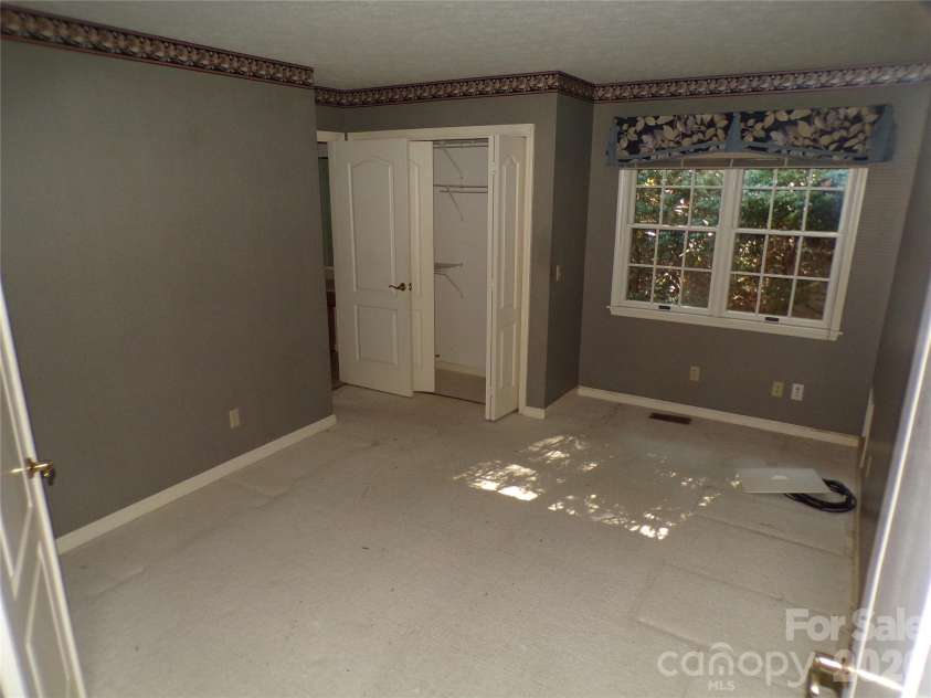 10 Governors Drive, Hendersonville, NC 28791.  MLS# CAR4433249, YatesRealty ID 55977. Front left middle bedroom/Study/Den