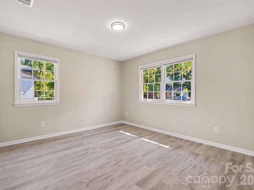 3801 Hillock Court, Charlotte, NC 28215.  MLS# CAR4432395, YatesRealty ID 55984. Spacious bedroom highlighted by double windows for ample natural light, fresh paint, and updated flooring.