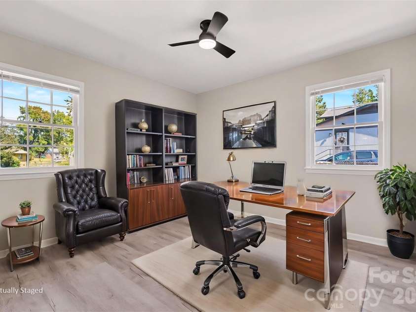 3801 Hillock Court, Charlotte, NC 28215.  MLS# CAR4432395, YatesRealty ID 55984. Spacious bedroom highlighted by double windows for ample natural light, fresh paint, and updated flooring. ( Virtually Stageg)