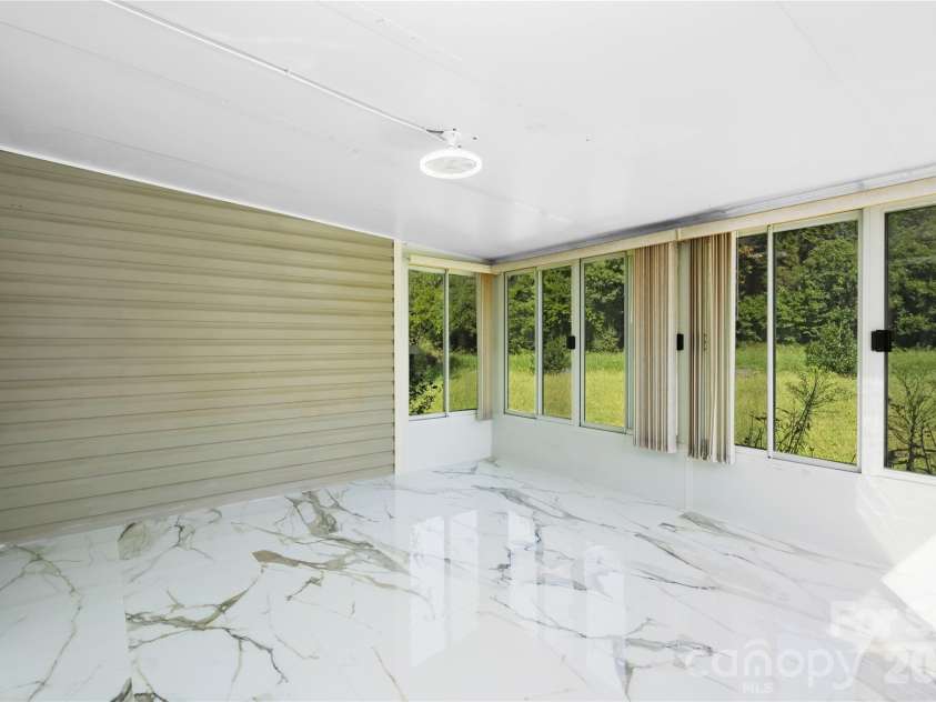 2065 Gary Lane, Hickory, NC 28602.  MLS# CAR4433074, YatesRealty ID 55987. SUNROOM , CALACATTA TILE 24X48