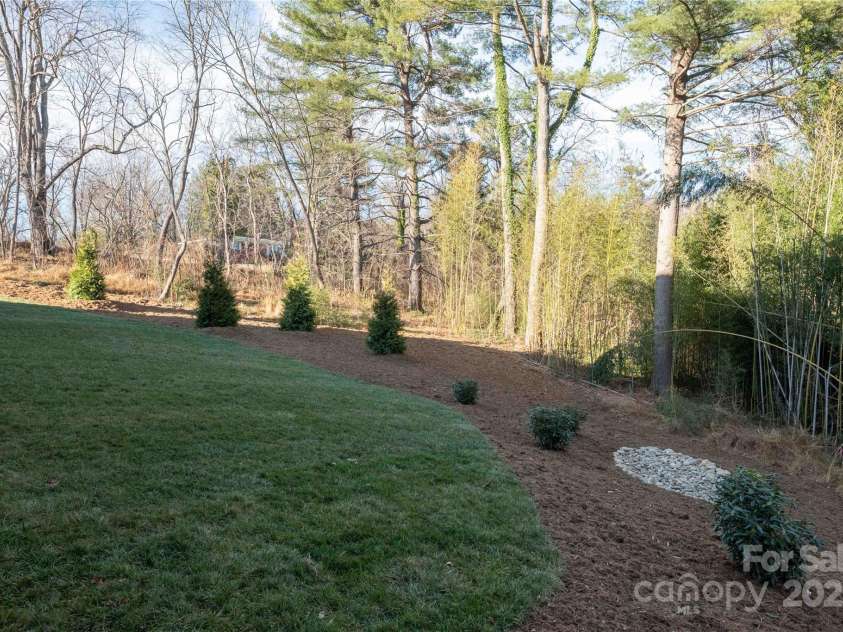 11 Kiftsgate Court, Asheville, NC 28804.  MLS# CAR4329278, YatesRealty ID 560. Backyard is flat and fencable