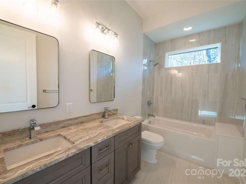 11 Kiftsgate Court, Asheville, NC 28804.  MLS# CAR4329278, YatesRealty ID 560. Guest Bath