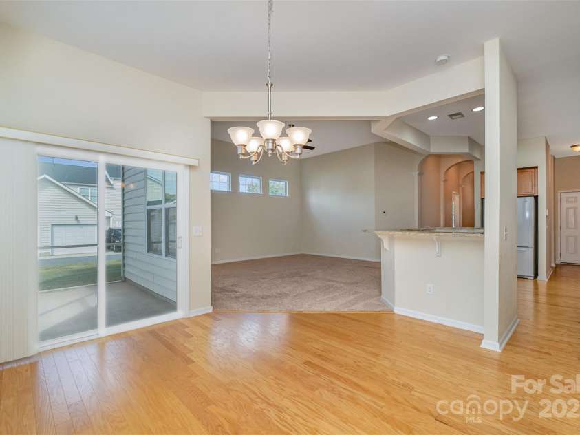 151 Glade Valley Avenue, Mooresville, NC 28117.  MLS# CAR4192412, YatesRealty ID 5601. Dinning and exit to screenedpatio