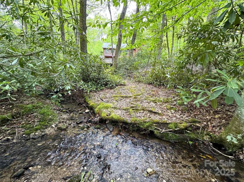 4102 Highway 221 None, Blowing Rock, NC 28605.  MLS# CAR4193880, YatesRealty ID 5602. Laurel Creek frontage (home shown BEFORE exterior stain in this photo)