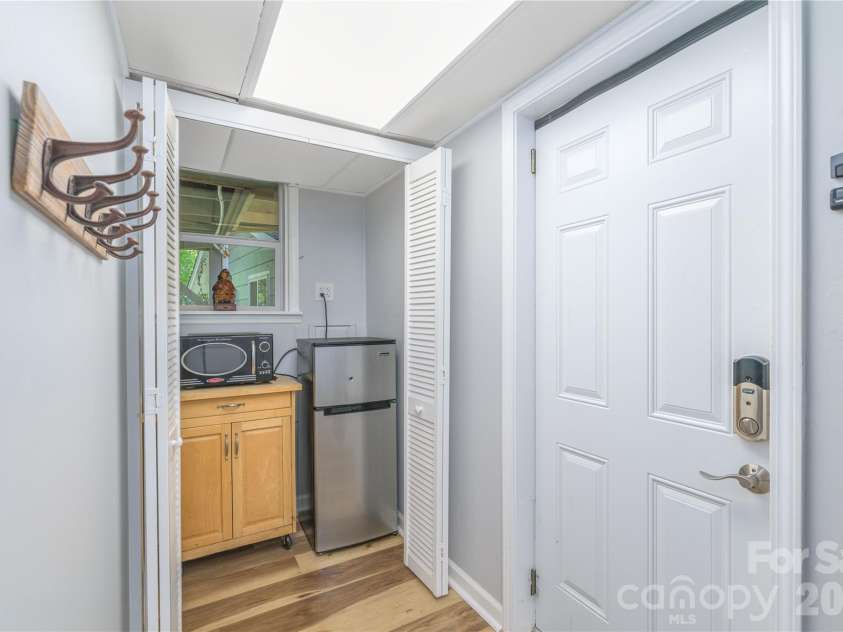 19 Springwood Drive, Asheville, NC 28805.  MLS# CAR4430580, YatesRealty ID 56029. Basement level exit/entry with dinette area