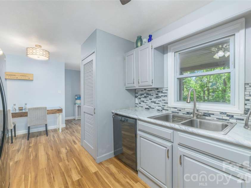 19 Springwood Drive, Asheville, NC 28805.  MLS# CAR4430580, YatesRealty ID 56029. Kitchen view--access to lower level