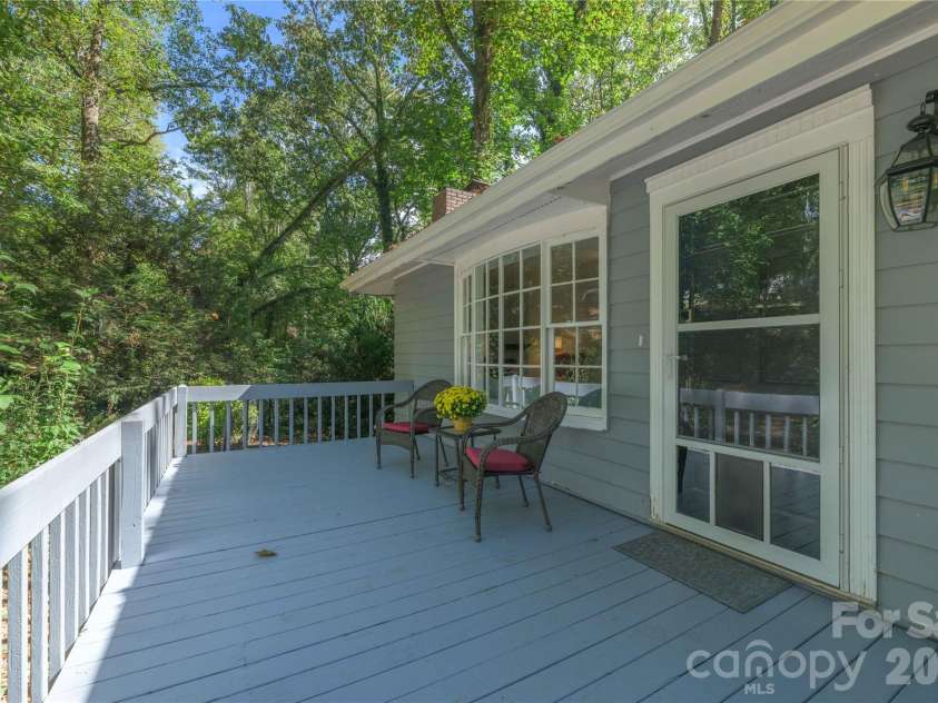 19 Springwood Drive, Asheville, NC 28805.  MLS# CAR4430580, YatesRealty ID 56029. Relaxing front deck