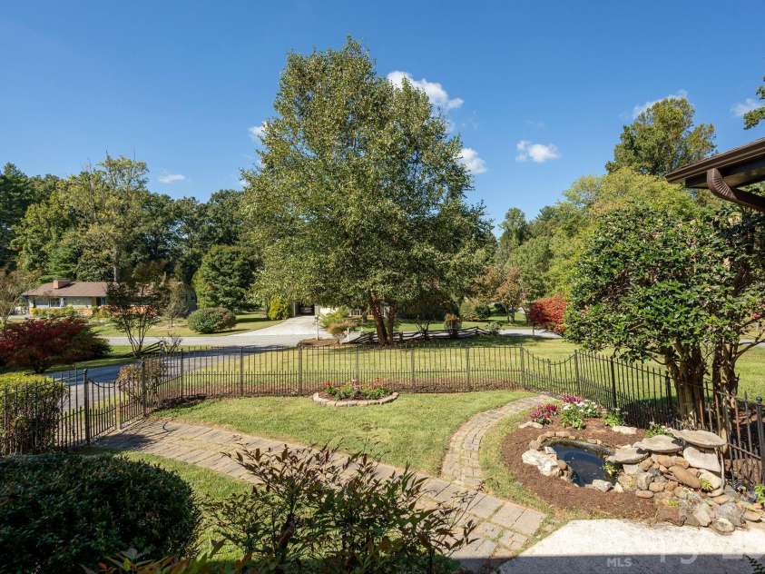 224 Lyndale Road, Hendersonville, NC 28739.  MLS# CAR4418202, YatesRealty ID 56030. Front yard and garden area
