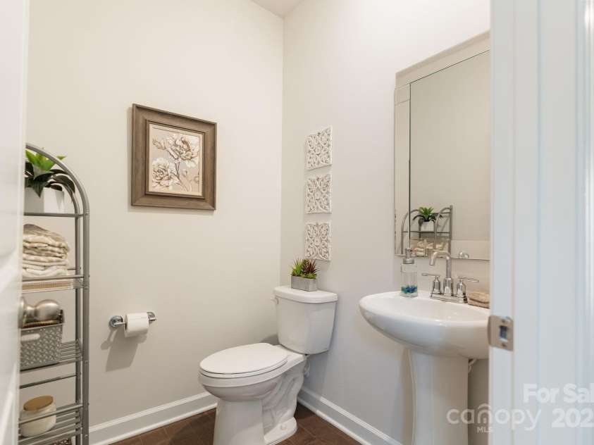 12425 Larue Lane, Huntersville, NC 28078.  MLS# CAR4231476, YatesRealty ID 5604. Main level half bath is perfect for guests