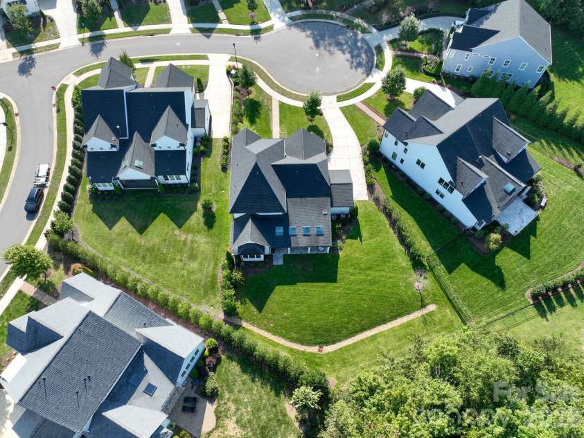 9588 Pacing Lane, Concord, NC 28027.  MLS# CAR4432011, YatesRealty ID 56073. Aerial view of Tree lined back yard and privacy