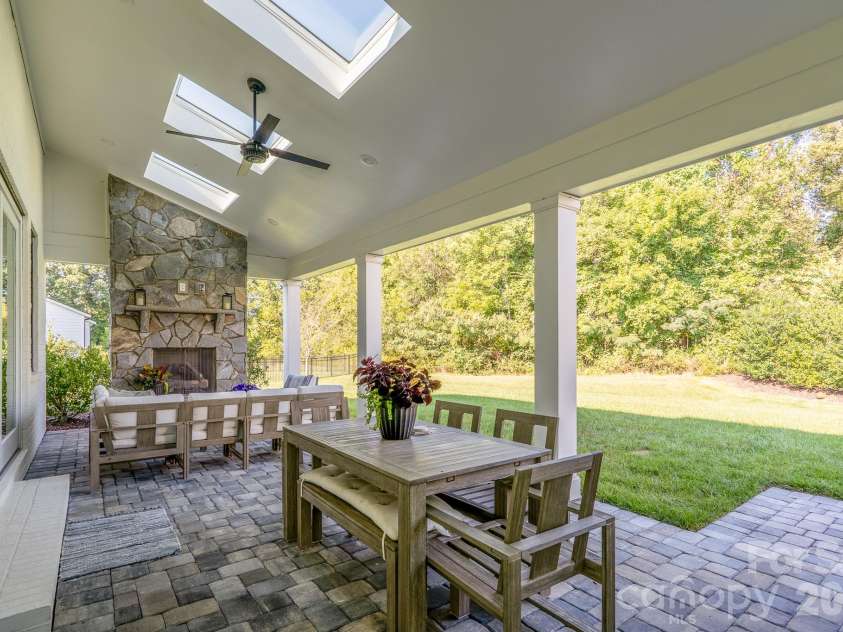 9588 Pacing Lane, Concord, NC 28027.  MLS# CAR4432011, YatesRealty ID 56073. Back Porch is covered, has bright Sky lights and Ceiling fan
