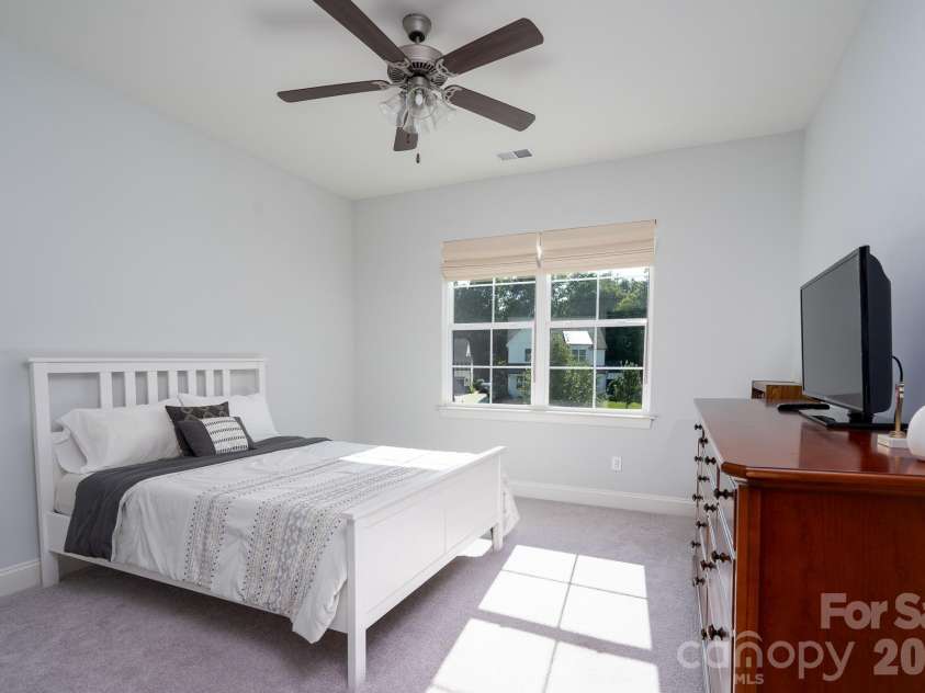 9588 Pacing Lane, Concord, NC 28027.  MLS# CAR4432011, YatesRealty ID 56073. Bright guest Bedroom facing the green space