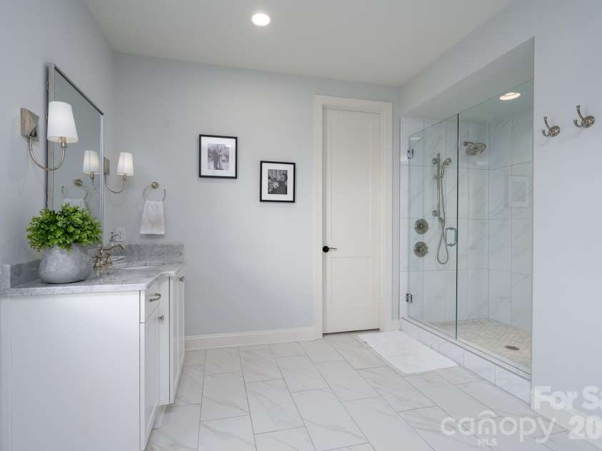 9588 Pacing Lane, Concord, NC 28027.  MLS# CAR4432011, YatesRealty ID 56073. This wide-open Primary Bath allows each to have the space needed.