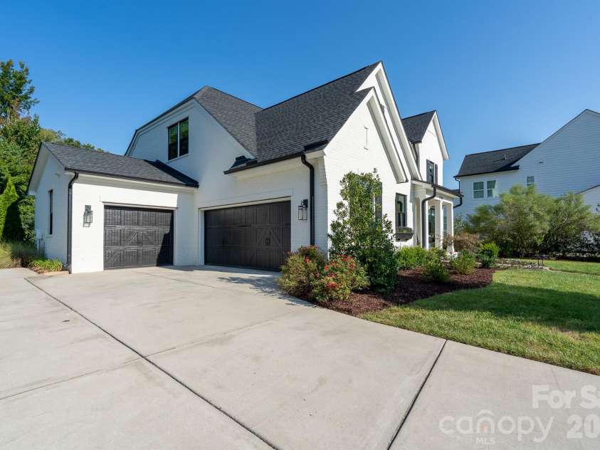 9588 Pacing Lane, Concord, NC 28027.  MLS# CAR4432011, YatesRealty ID 56073. Three Car attached Garage with extra wide driveway for additional parking