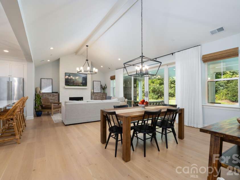 9588 Pacing Lane, Concord, NC 28027.  MLS# CAR4432011, YatesRealty ID 56073. Vaulted ceilings in Dining Room finished off with custom Lighting