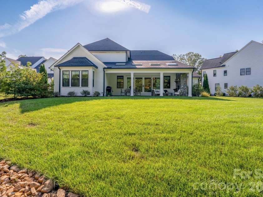 9588 Pacing Lane, Concord, NC 28027.  MLS# CAR4432011, YatesRealty ID 56073. View of entire back yard with full irrigation.