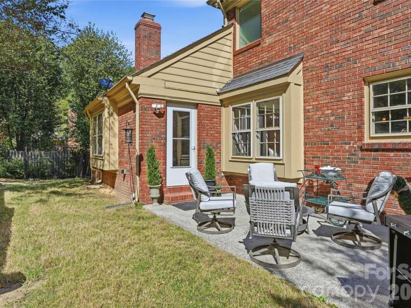 717 Fredricksburg Road, Matthews, NC 28105.  MLS# CAR4428487, YatesRealty ID 56079. Back patio