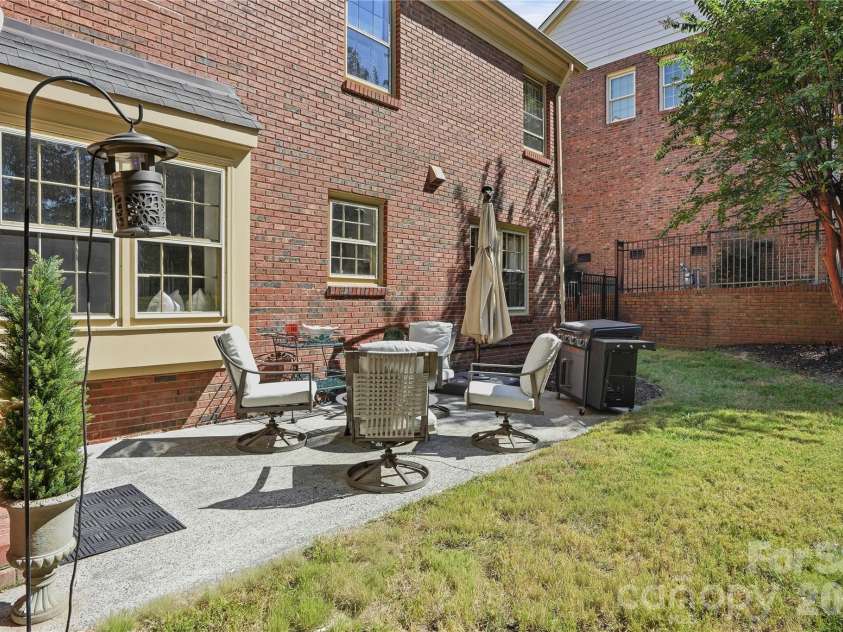 717 Fredricksburg Road, Matthews, NC 28105.  MLS# CAR4428487, YatesRealty ID 56079. Back patio