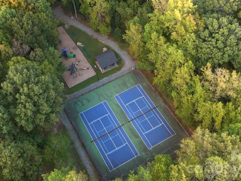 717 Fredricksburg Road, Matthews, NC 28105.  MLS# CAR4428487, YatesRealty ID 56079. Community tennis/pickleball courts