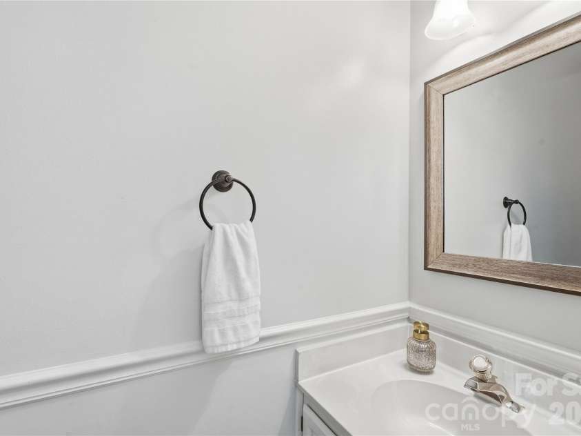 717 Fredricksburg Road, Matthews, NC 28105.  MLS# CAR4428487, YatesRealty ID 56079. Powder room on main level