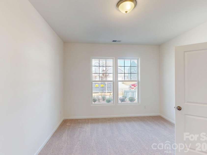 920 Barker Street, Monroe, NC 28112.  MLS# CAR4315513, YatesRealty ID 5608. Main level bedroom