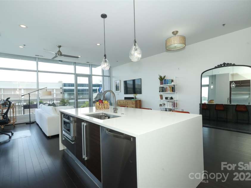 1100 Metropolitan Avenue, Charlotte, NC 28204.  MLS# CAR4241116, YatesRealty ID 5612. Incredible quartz waterfall  with hidden storage on the other side.