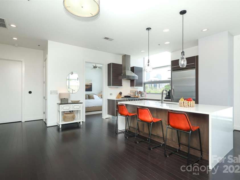 1100 Metropolitan Avenue, Charlotte, NC 28204.  MLS# CAR4241116, YatesRealty ID 5612. View of the kitchen and into the bedroom.  The door on the left is the door to the bathroom.