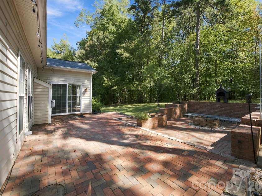 195 Huntly Lane, Mooresville, NC 28115.  MLS# CAR4433236, YatesRealty ID 56123. Back yard with patio and fire pit