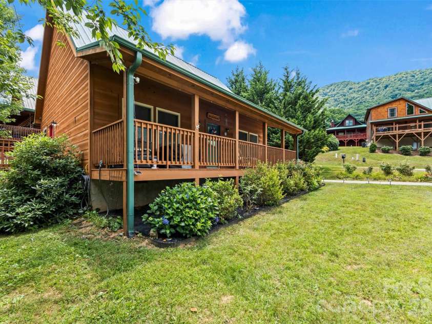 588 Panoramic Loop, Maggie Valley, NC 28751.  MLS# CAR4431380, YatesRealty ID 56124. Full length Covered Porch