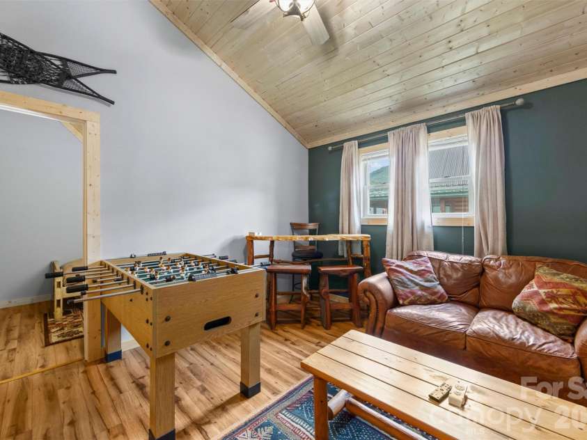 588 Panoramic Loop, Maggie Valley, NC 28751.  MLS# CAR4431380, YatesRealty ID 56124. Game room in the loft