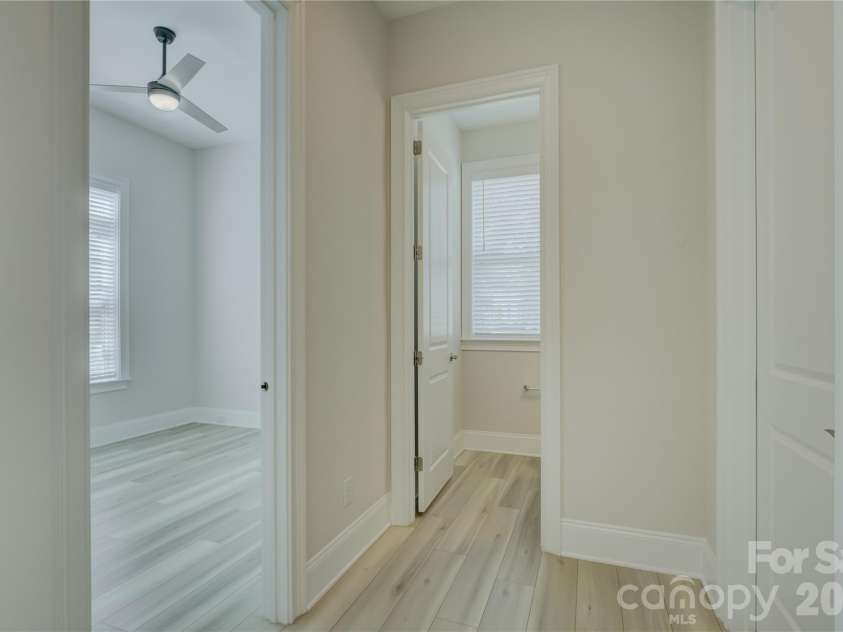 82105 Standing Oak Drive, Charlotte, NC 28278.  MLS# CAR4410343, YatesRealty ID 56131. Hallway to the office and 1/2 bath