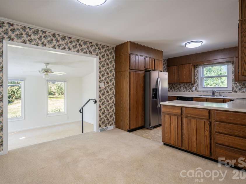 23 Wagon Road, Asheville, NC 28805.  MLS# CAR4433156, YatesRealty ID 56141. Dining area/Kitchen/Den