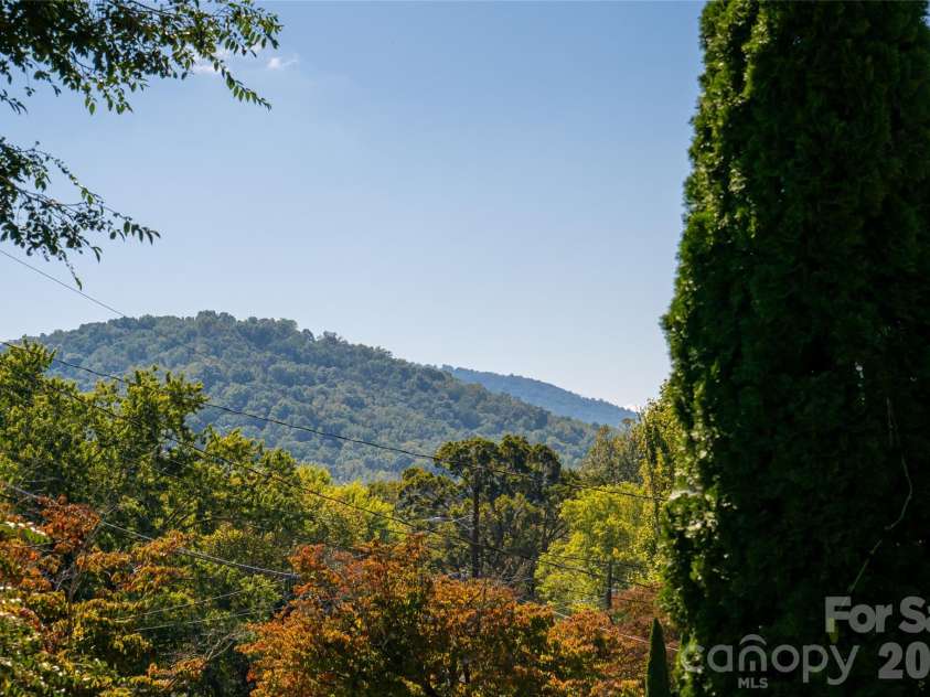 23 Wagon Road, Asheville, NC 28805.  MLS# CAR4433156, YatesRealty ID 56141. Mountain view from front porch