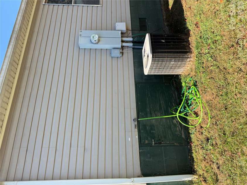 97 Fair Haven Drive, Burnsville, NC 28714.  MLS# CAR4433104, YatesRealty ID 56186. Crawl space access and HVAC
