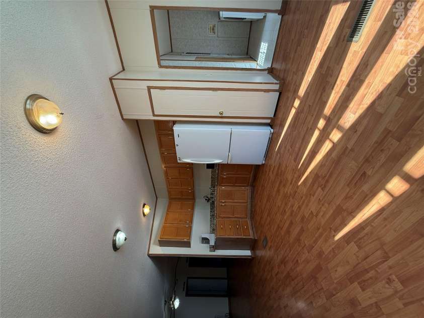 97 Fair Haven Drive, Burnsville, NC 28714.  MLS# CAR4433104, YatesRealty ID 56186. Dining area looking into laundry