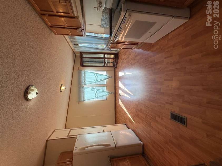 97 Fair Haven Drive, Burnsville, NC 28714.  MLS# CAR4433104, YatesRealty ID 56186. Dining area surrounded by windows