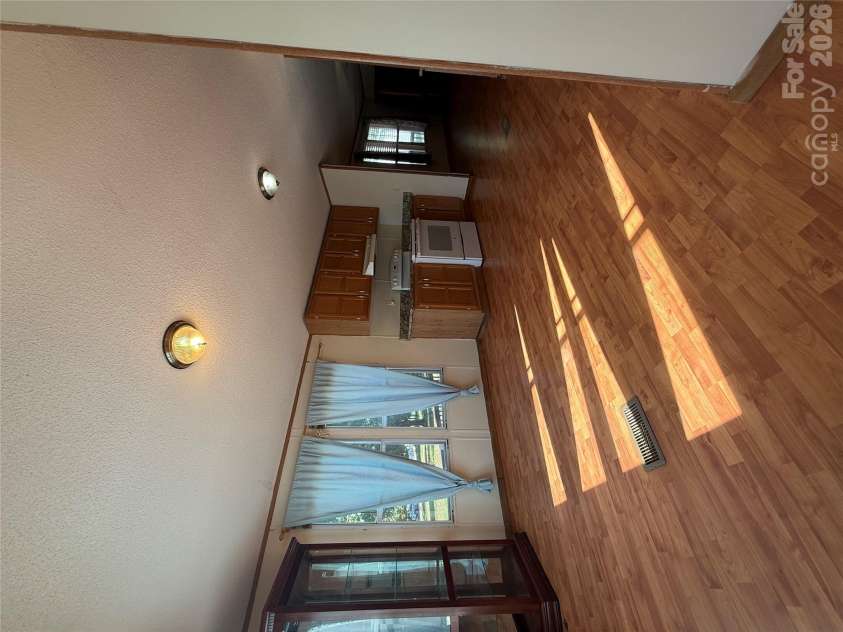 97 Fair Haven Drive, Burnsville, NC 28714.  MLS# CAR4433104, YatesRealty ID 56186. Kitchen view from the laundry area
